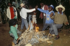 Rara leaders do spiritual work over a bonfire